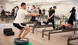 Individuals participating in a dynamic exercise session led by a physiotherapist at Yates Physiotherapy Clinic in Adelaide